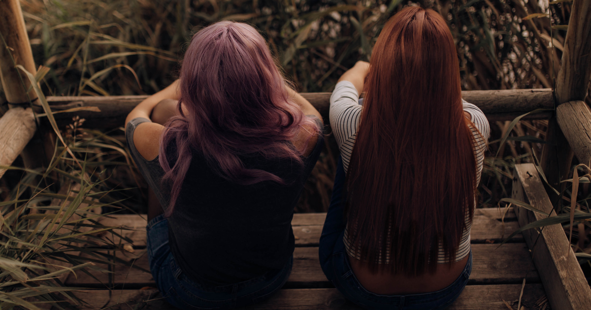 friends growing apart symbolizing friendship breakups and emotional growth; person reflecting on friendship loss and change